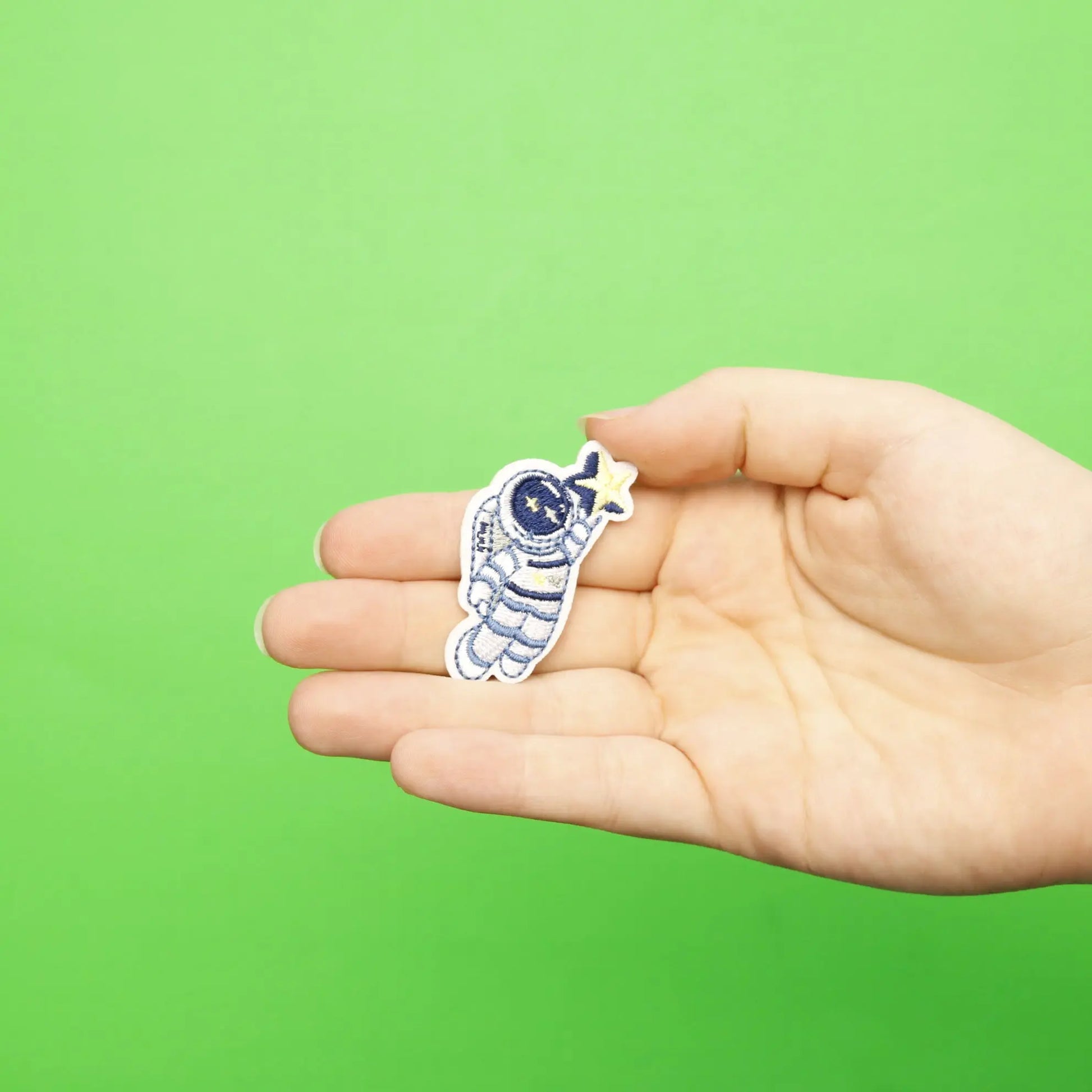 Small Blue Astronaut Holding A Star Embroidered Iron On Patch 